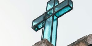 black metal frame glass cross decor